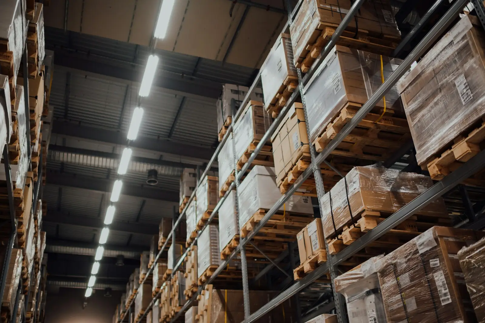 Warehouse racking stocked with cardboard cases